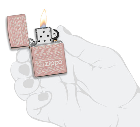 Zippo Lighter Highly Polished Rose Gold Geometric Pattern Waves Logo Online Only Open with Flame in Stylised Hand